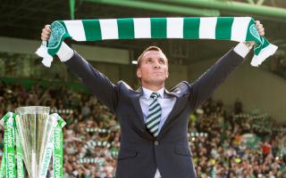 Brendan Rodgers holds the Celtic scarf aloft