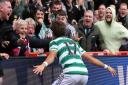 Jota celebrates with the Celtic fans after his goal against Livingston.