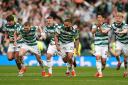 The Celtic players celebrate the shootout win