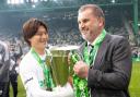 Kyogo and Ange Postecoglou hold the Premiership trophy