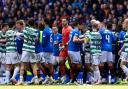 Celtic and Rangers' players clash