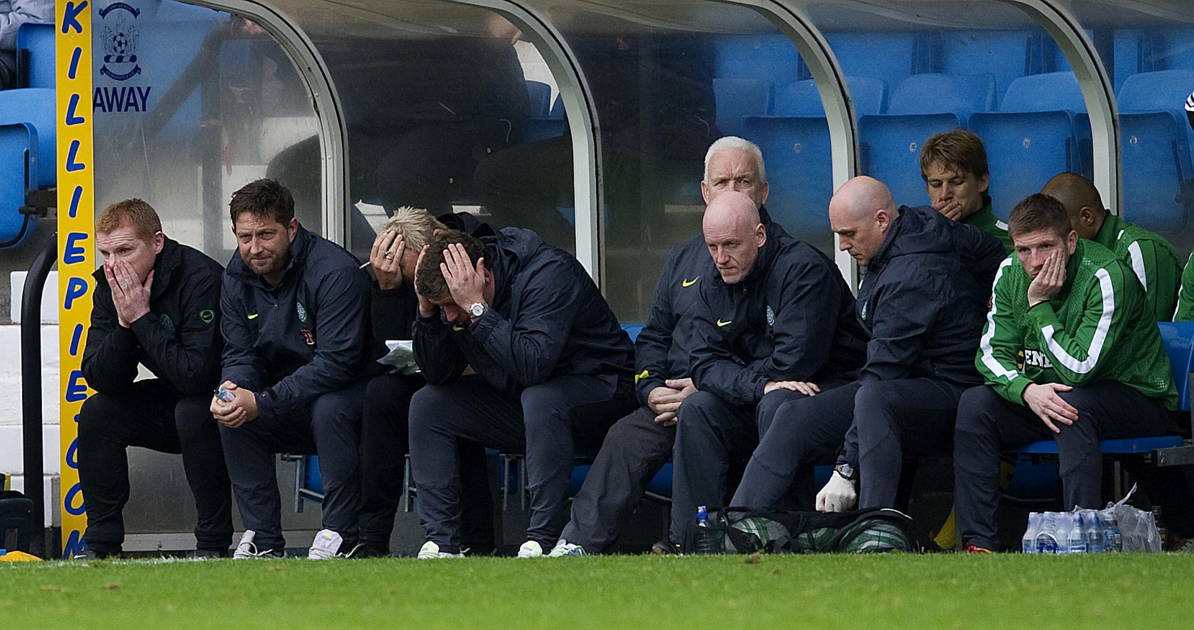 Celtic Way: The Celtic bench watch on in disbelief as Kilmarnock go three goals up at Rugby Park