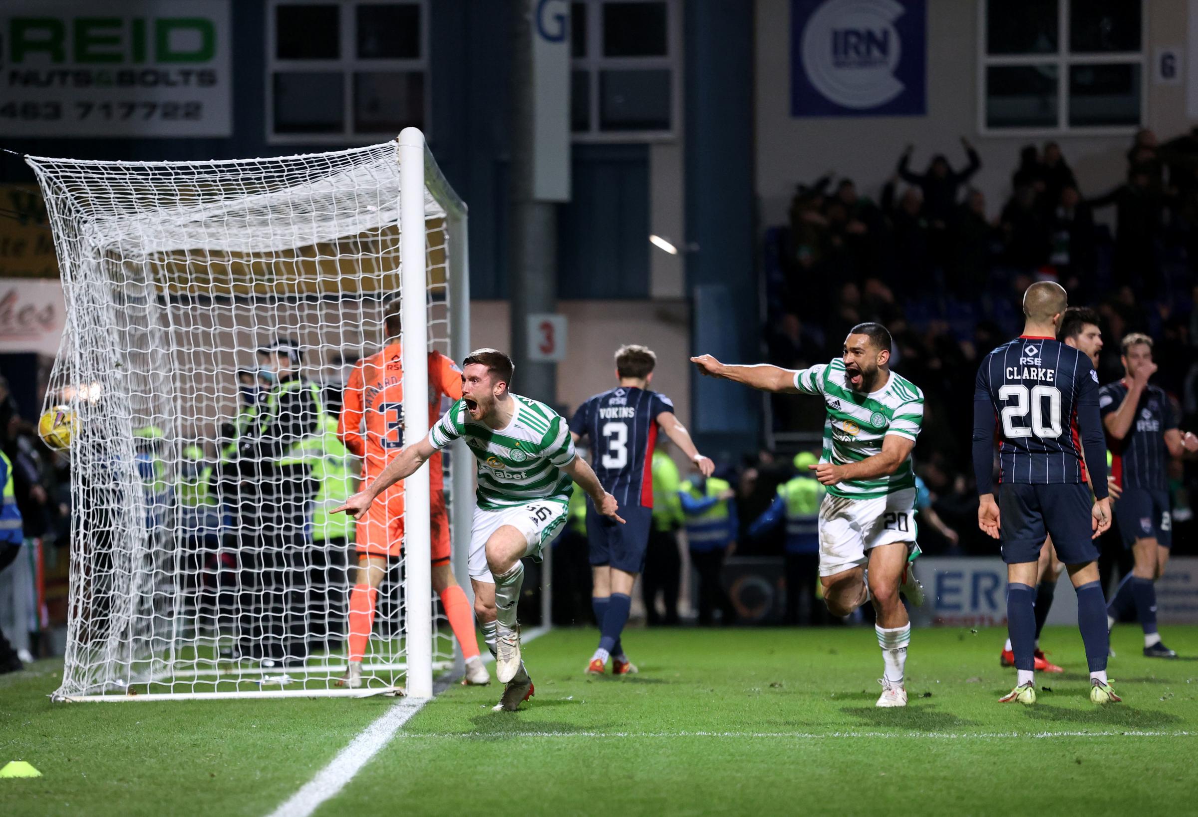 Celtic Way: Anthony Ralston wheels away after heading in the 97th-minute winner