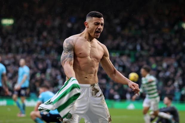 Giorgos Giakoumakis celebrates as the third goal of his hat-trick finally sealed the points for Celtic against Dundee.