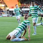 Giorgos Giakoumakis celebrates after scoring the goal that ultimately sealed the Premiership title for Celtic.