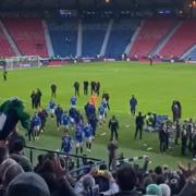 Rangers players trudge off the field at Hampden