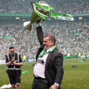 Celtic boss Ange Postecoglou celebrates with the Scottish Premiership trophy