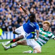 Liam Scales throws himself into a tackle at Ibrox