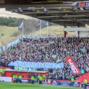 The banner held aloft by Celtic fans
