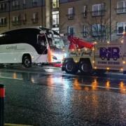 The Dundee team bus being towed