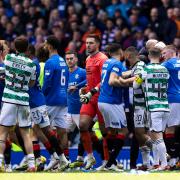 Celtic and Rangers' players clash
